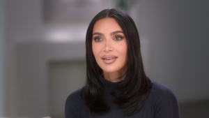 Kim Kardashian wears all black while speaking to the confessional camera on The Kardashians in 2023.
