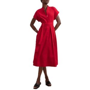 A woman wearing a red midi dress