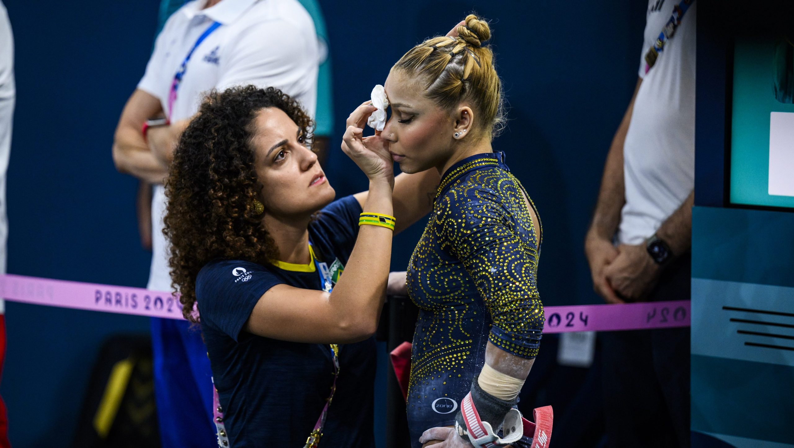 PARIS, FRANCE - JULY 30: Flavia Saraiva of Team Brazil receives medical treatment during the Artistic Gymnastics Women's Team Final on day four of the Olympic Games Paris 2024 at the Bercy Arena on July 30, 2024 in Paris, France. (Photo by Tom Weller/VOIGT/GettyImages)