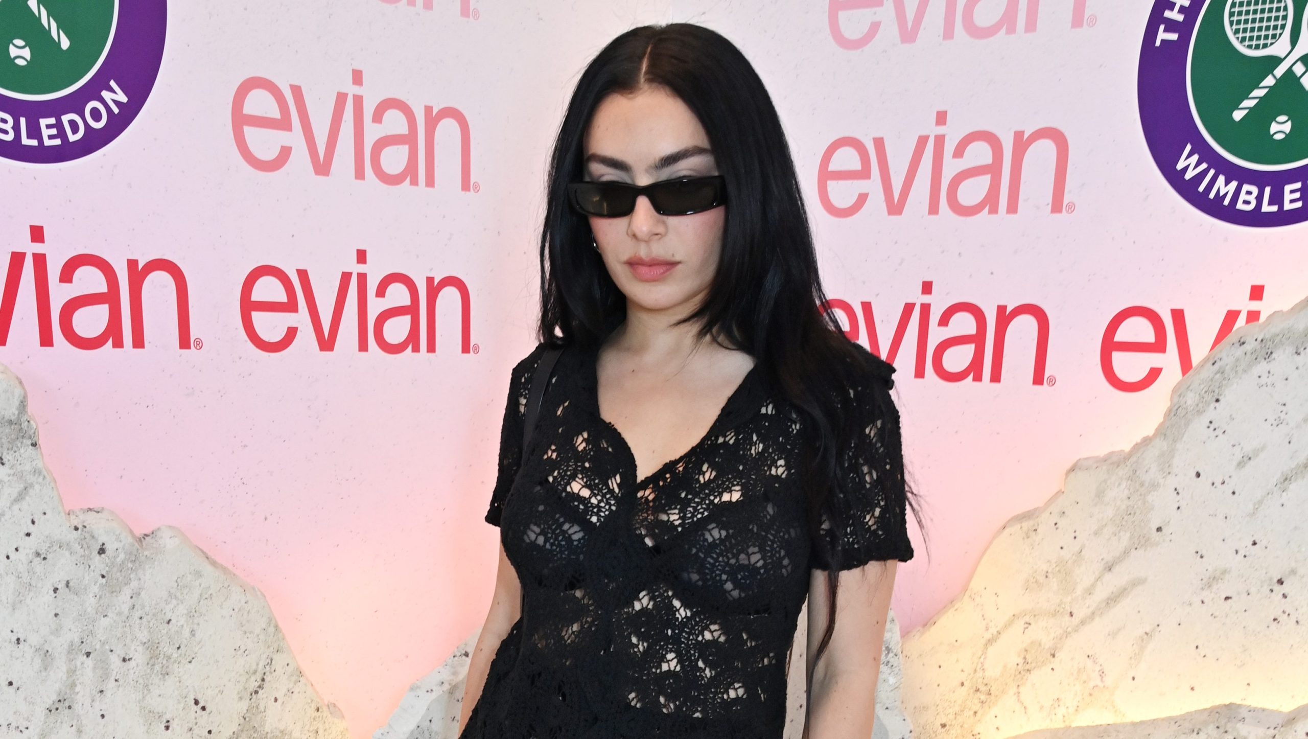 LONDON, ENGLAND - JULY 11: Charli XCX poses in the evian 'Mountain Of Youth' VIP suite during day 11 of Wimbledon 2024 on July 11, 2024 in London, England. (Photo by Dave Benett/Getty Images for evian)