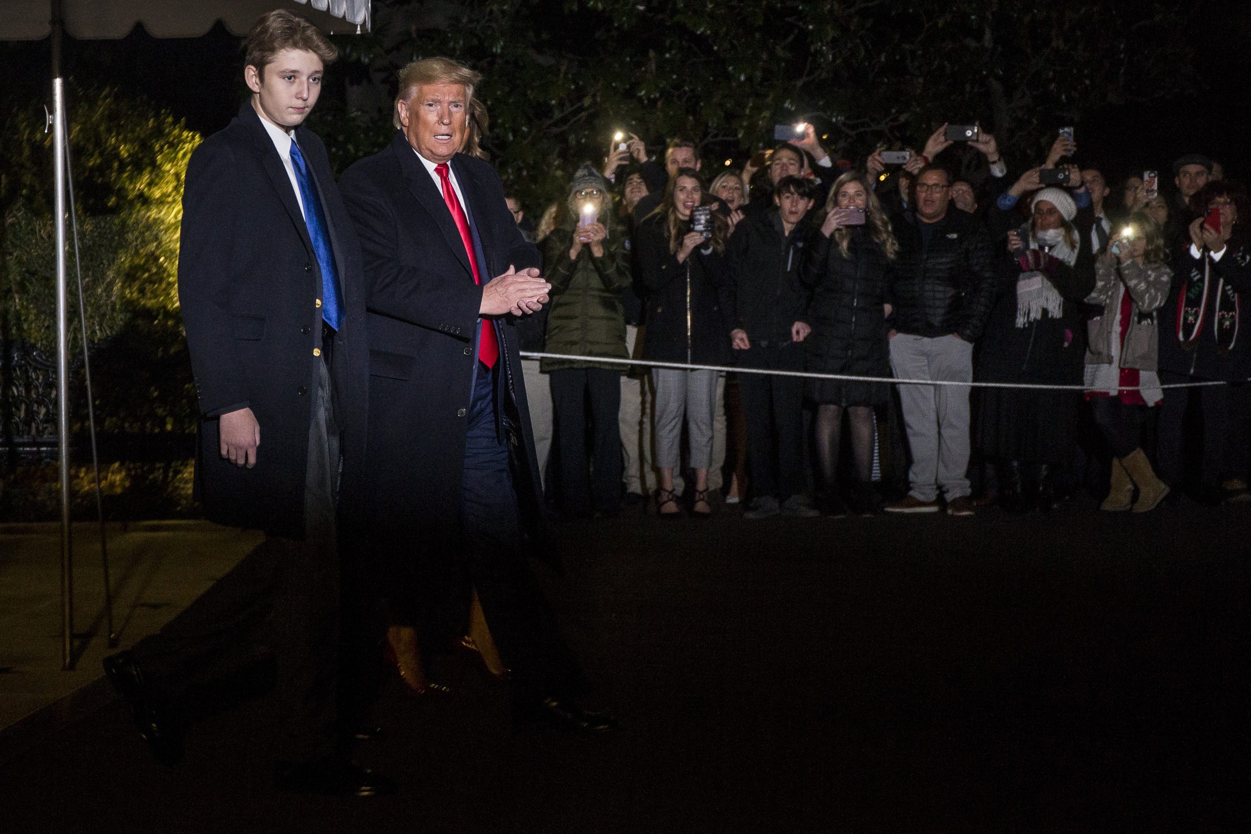 WASHINGTON, DC - DECEMBER 20: President Donald Trump leaves the White House before departing for Joint Base Andrews on December 20, 2019 in Washington, DC.  President Trump will sign S.1790, the "National Defense Authorization act for FY2020" at JBA before traveling to West Palm Beach, FL.  Also pictured is President Trump's son, Barron Trump.  (Photo by Zach Gibson/Getty Images)