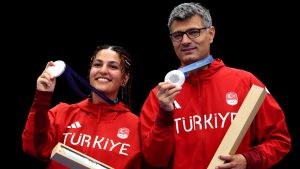 CHATEAUROUX, FRANCE - JULY 30: Silver medalists Sevval Ilayda Tarhan and Yusuf Dikec of Team Turkiye pose on the podium during the Shooting 10m Air Pistol Mixed Team medal ceremony on day four of the Olympic Games Paris 2024 at Chateauroux Shooting Centre on July 30, 2024 in Chateauroux, France. (Photo by Charles McQuillan/Getty Images)