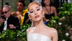 Ariana Grande posing in a white gown at the 2024 Met Gala