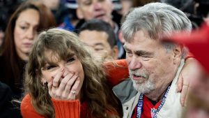 BALTIMORE, MARYLAND - JANUARY 28: Taylor Swift reacts as she hugs Ed Kielce after the AFC Championship NFL football game between the Kansas City Chiefs and Baltimore Ravens at M&T Bank Stadium on January 28, 2024 in Baltimore, Maryland. (Photo by Kara Durrette/Getty Images)