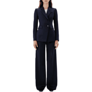 navy suit with seamed waist; model is standing as if she