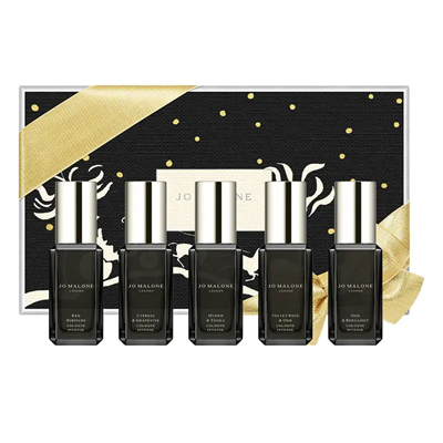 5 perfumes in black bottles with a black and gold gift box behind them